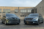 2022 Kia Carnival, silver, and 2021 Toyota Sienna, green